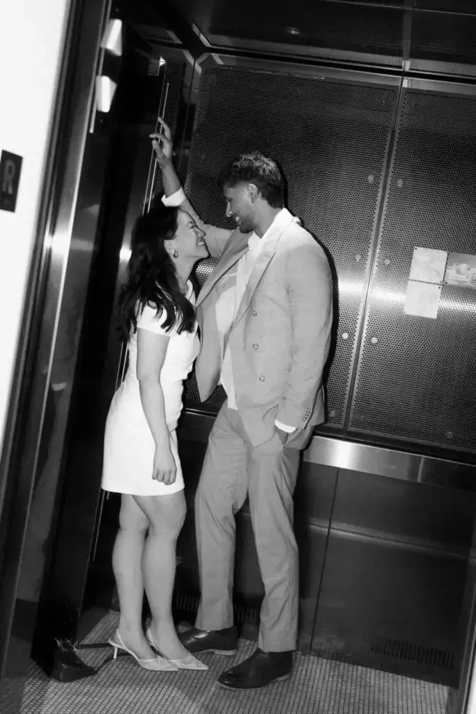 Neel and Grace together in an elevator