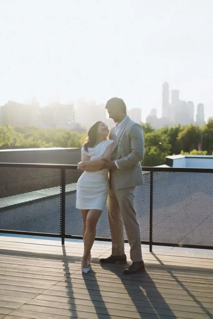 Neel and Grace embracing against the Toronto skyline